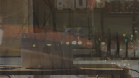 Financial Data Processing on Laptop in Dim Lit Environment