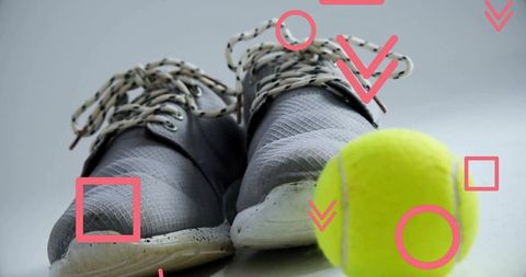 Dynamic athletic shoes with tennis ball and graphic elements