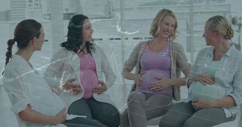 Pregnant women connecting during a prenatal class