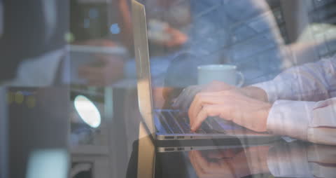Overlay of Businessman Typing and Woman in a Warehouse