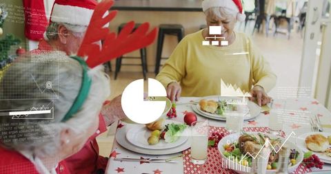 Seniors celebrating holiday dinner in santa hats and reindeer antlers with data overlay