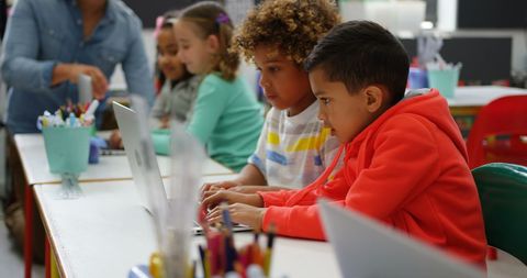 Engaged Children Collaborating on Laptops in Classroom - Download Free Stock Images Pikwizard.com