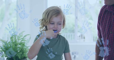 Child Practicing Oral Hygiene at Home with Parent's Guidance