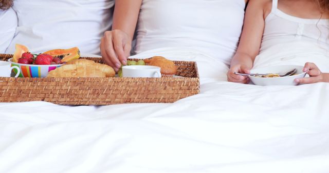 Family Enjoying Breakfast in Bed with Fresh Fruits and Pastries - Download Free Stock Images Pikwizard.com