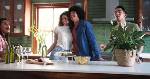 Diverse Friends Celebrating in Cozy Modern Kitchen