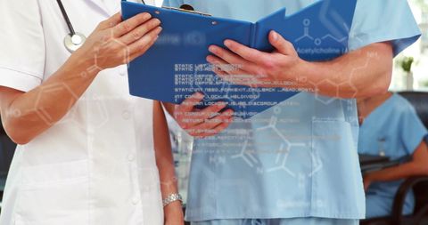 Healthcare Professionals Analyzing Medical Records with Digital Interface