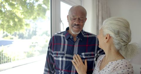 Senior Couple Sharing a Peaceful Moment in Sunlit Room - Download Free Stock Images Pikwizard.com