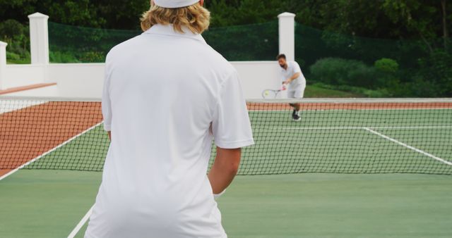 Tennis Players Competing on Outdoor Court During Summer - Download Free Stock Images Pikwizard.com