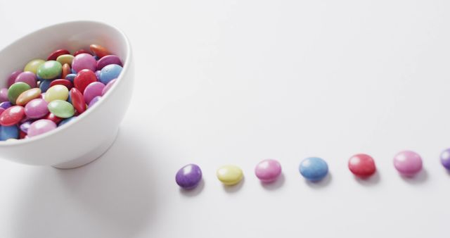 Colorful Candy in Bowl and Row Arrangement on White Background - Download Free Stock Images Pikwizard.com