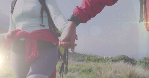 Couple Holding Hands During Scenic Outdoor Hike