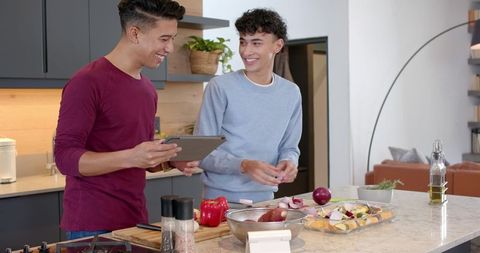 Friends Cooking Together in Modern Kitchen Using Tablet Inspiration