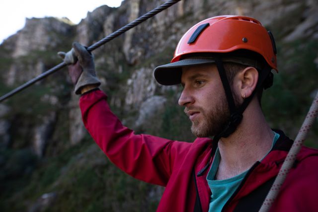 Man Wearing Zip Lining Equipment in Mountain Adventure - Download Free Stock Photos Pikwizard.com