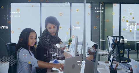 Collaboration in Modern Office with Digital Graphics Overlay