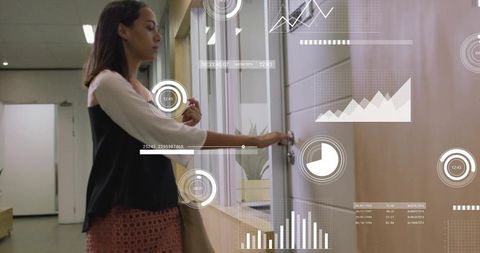 Professional woman accessing office with keycard and hud data overlays showing analytics