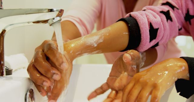 Mother and Child Washing Hands in Bathroom Faucet - Download Free Stock Images Pikwizard.com