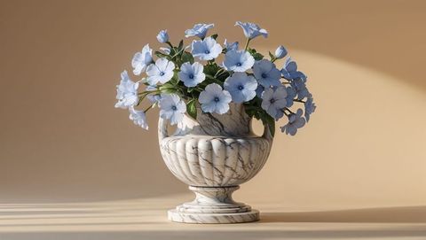 Elegant white marble urn with pastel blue forget me not flowers