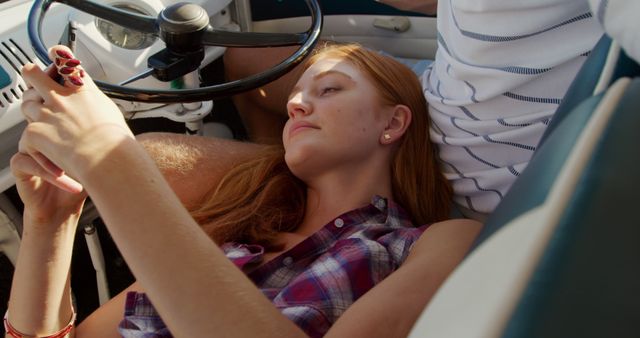 Young Woman Relaxing in Car with Smartphone - Download Free Stock Images Pikwizard.com