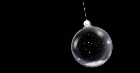 Minimalistic Glass Bauble with Silver Cap on Black Background
