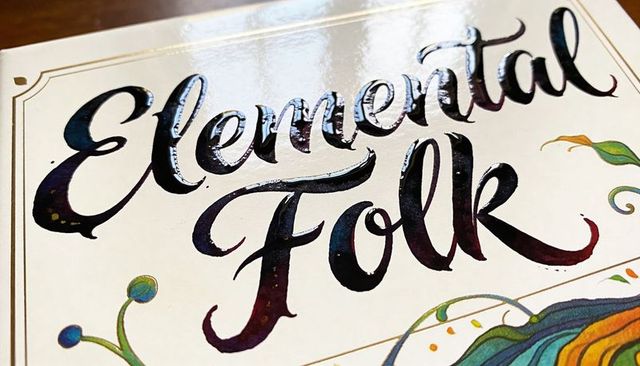 Elemental folk embossed book cover with iridescent foil, ornate botanical calligraphy