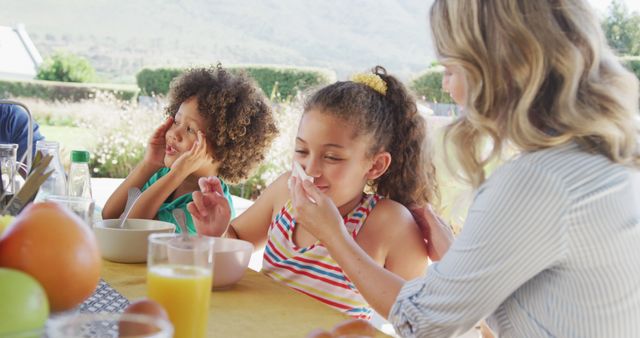 Mother Enjoying Breakfast Outdoors with Son and Daughter - Download Free Stock Images Pikwizard.com