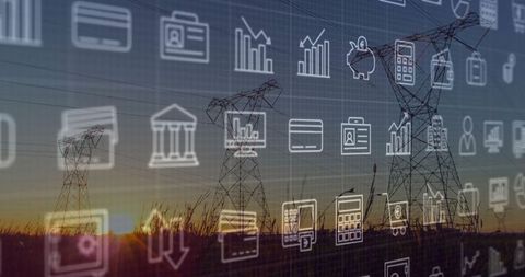 High-voltage towers with digital financial icons at sunset