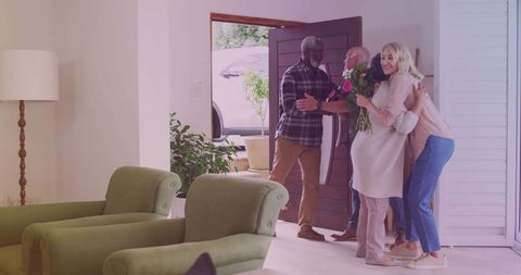 Diverse Friends Share Warm Welcome in Cozy Living Room