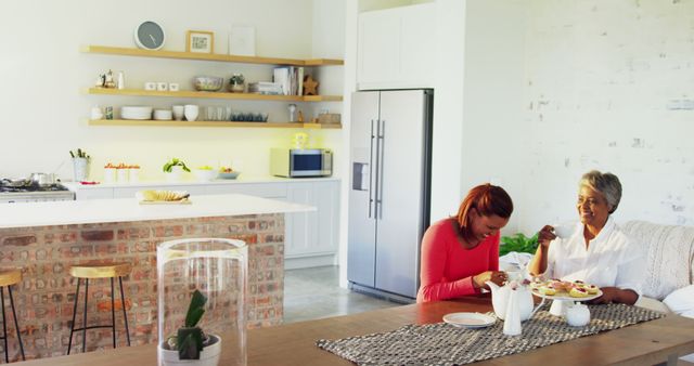 Family Enjoying Tea Time in Modern Bright Kitchen - Download Free Stock Images Pikwizard.com