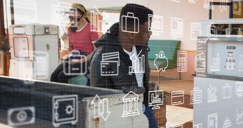 Digital Data Icons Overlay on Diverse Young Professionals in Classroom Setting