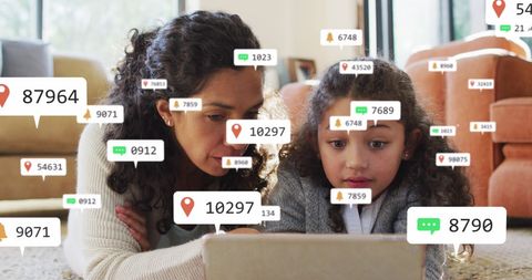 Mother and daughter tracking data growth on tablet