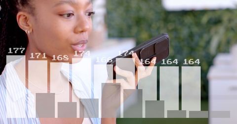 Businesswoman Using Smartphone Technology with Digital Data Overlay