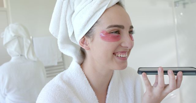 Woman with Eye Patches and Towel Talking on Phone in Bathroom - Download Free Stock Images Pikwizard.com