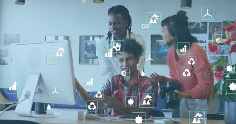 Multiracial Team Analyzing Ecological Data in Modern Office