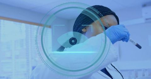 Scientist Examining Blood Sample with Digital Interface Overlay
