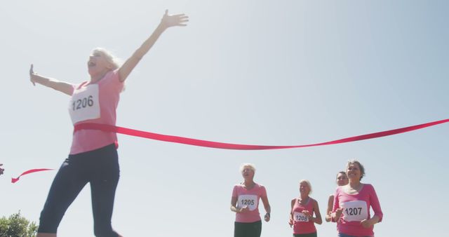 Senior Woman Celebrating Victory in Fun Run Marathon - Download Free Stock Images Pikwizard.com