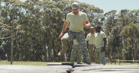 Soldiers Training Endurance on Obstacle Course Outdoors