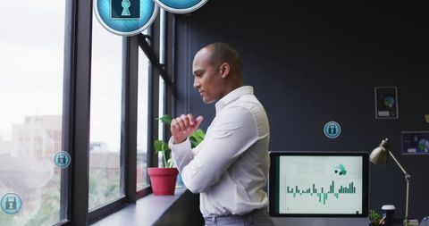 Businessman Contemplating Cybersecurity in Modern Office