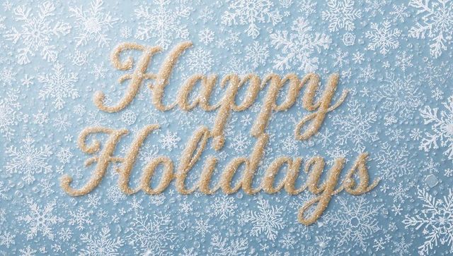 Sparkling gold cursive happy holidays on icy blue snowflake background