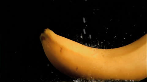 Fresh Banana in Slow Motion Splash Against Black