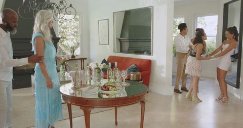 Guests Arriving at Elegant Wedding Celebration in Chic Interior