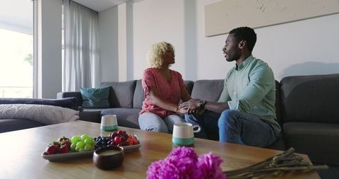 Couple Having a Warm Conversation in Cozy Living Room