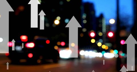 Arrows indicating urban growth and progress on night city street