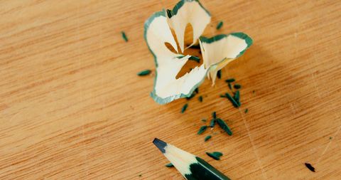 Colorful Green Pencil and Shavings on Wooden Surface - Download Free Stock Images Pikwizard.com