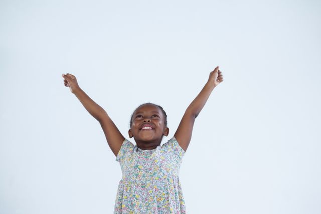 Joyful African American Girl with Arms Raised - Download Free Stock Photos Pikwizard.com
