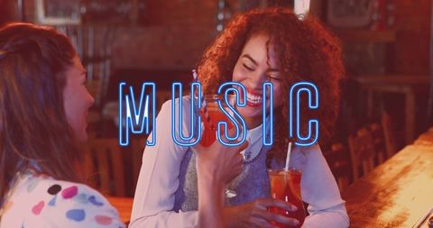 Joyful Friends Sharing Drinks with Neon Music Text Overlay