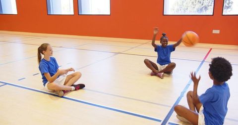 Children Playing Basketball in Gym, Developing Teamwork Skills