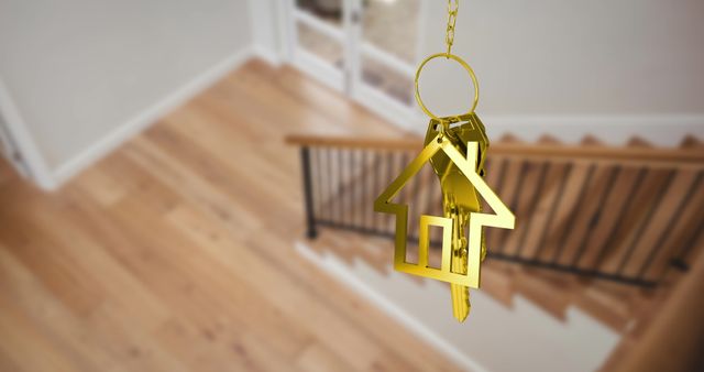 Golden house key with home symbol hovering over blurred wooden stairs and railing in bright home interior. Ideal for illustrating themes like real estate acquisition, moving day excitement, property purchase, and homeownership. Useful for real estate agencies, interior design brands, and home improvement services to advertise products or services related to homes and moving.