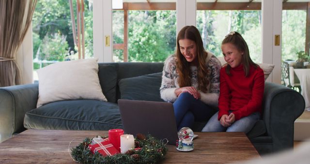 Mother and Daughter Video Calling Family on Christmas Eve - Download Free Stock Images Pikwizard.com