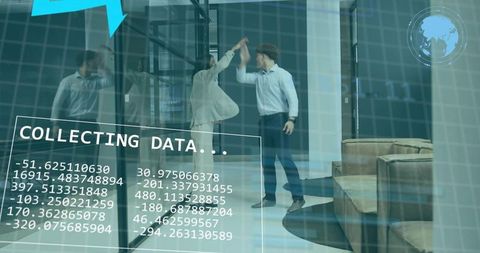 High-fiving coworkers in glass office with augmented data overlay, analytics dashboard, teamwork