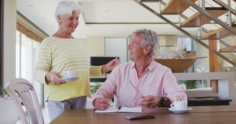 Senior Couple Enjoying Coffee While Managing Household Finances - Download Free Stock Images Pikwizard.com