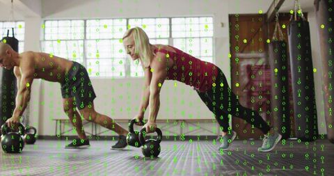 Partner kettlebell plank core training man shirtless woman maroon tank balancing studio